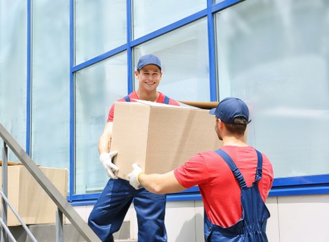 Brompton household relocation service with boxes and furniture being unloaded