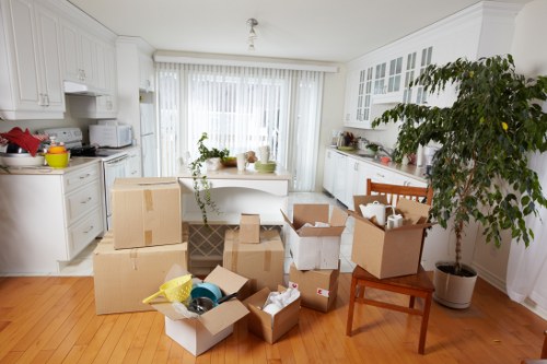 Office movers handling equipment and furniture during a Brompton relocation
