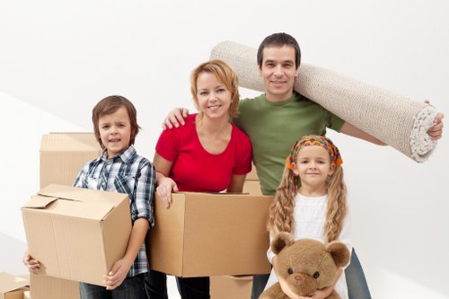 Packed moving boxes ready for urgent relocation in Brompton