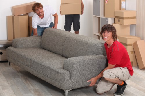 Residential moving team handling furniture in Brompton