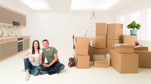 Professional moving van loading boxes in Brompton