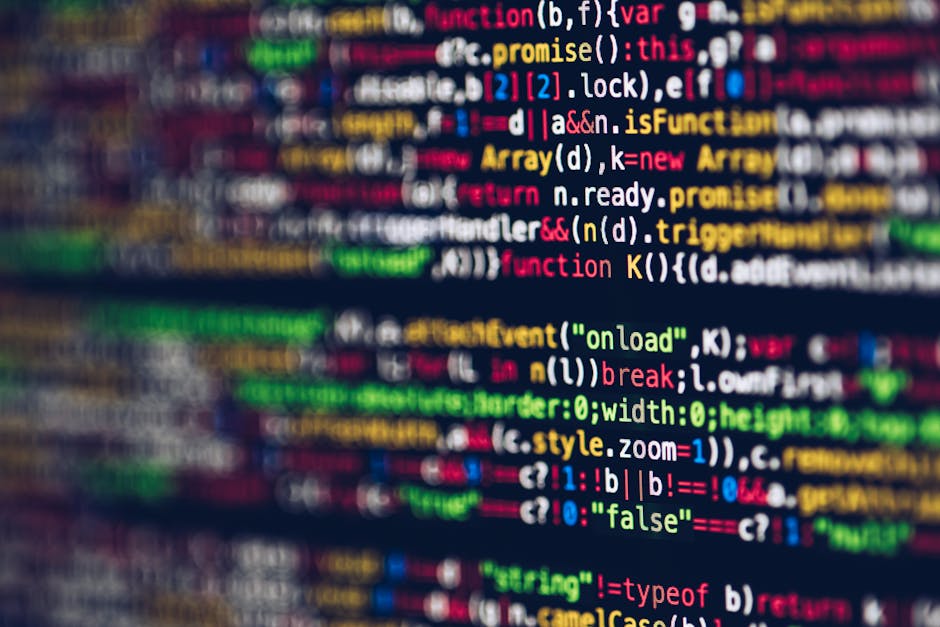 Photograph of a computer screen displaying a code editor with an HTML document open. The code includes tags such as html, head, meta, title, and link, with some styling and structure visible. The scre
